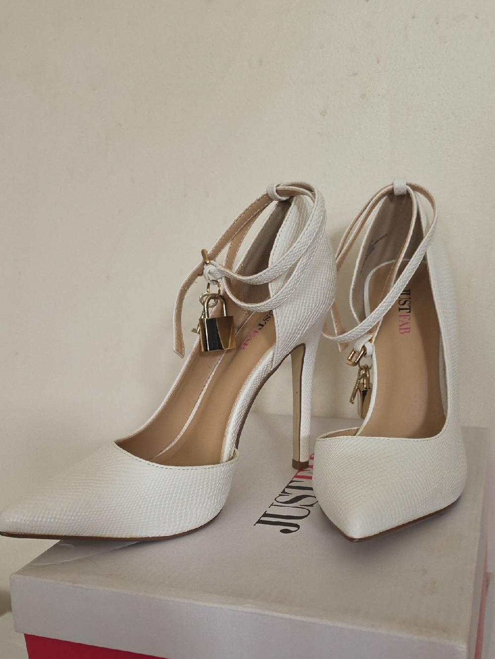 White Pointed Toe Ankle-Wrap Stiletto Heels with Gold Padlock Accent